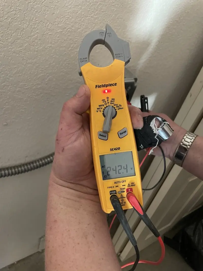 Voltage testing with clamp meter during Electrical Installation Services in Norwalk